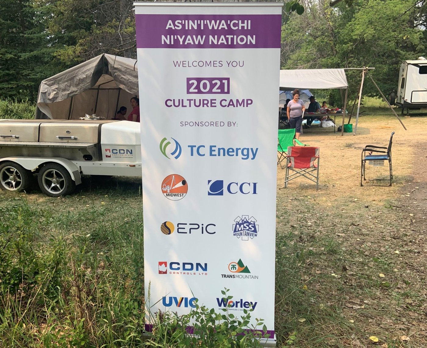 The 2021 culture camp sign includes Midwest among the sponsors.