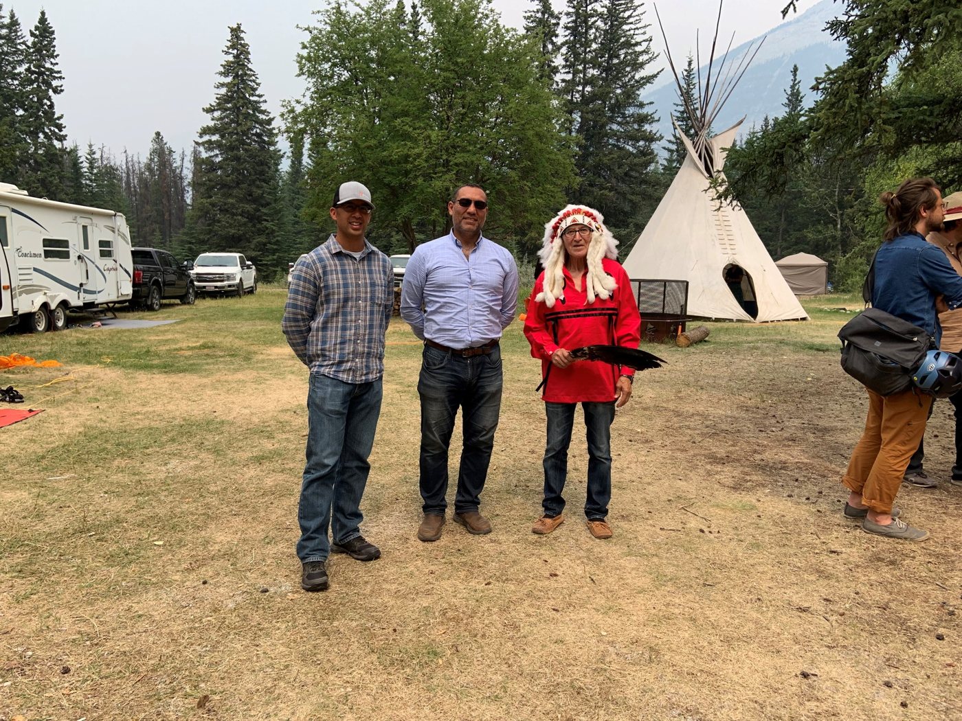 Group photographed at the KLCN culture camp, with a tipi in the background.